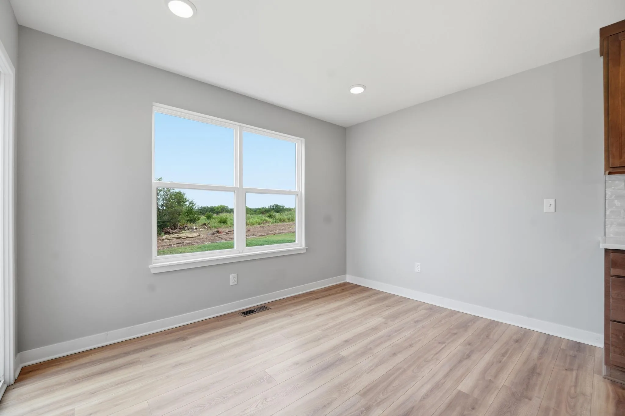 Spacious second bedroom in the Gardenia Farmhouse Floorplan 808 Glenn Cir Lot 144