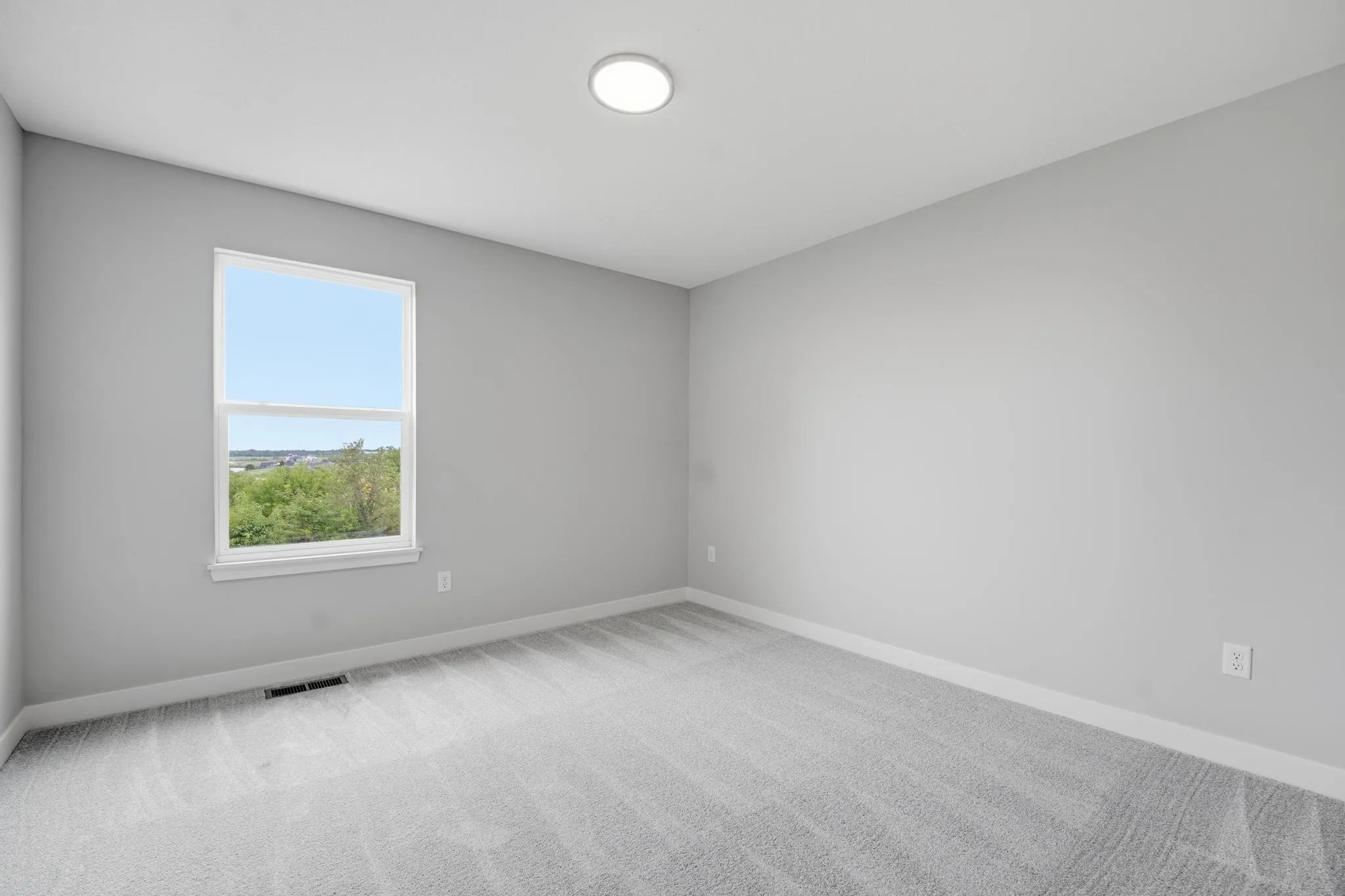 Spacious third bedroom featured in the Gardenia Farmhouse Floorplan 808 Glenn Cir Lot 144