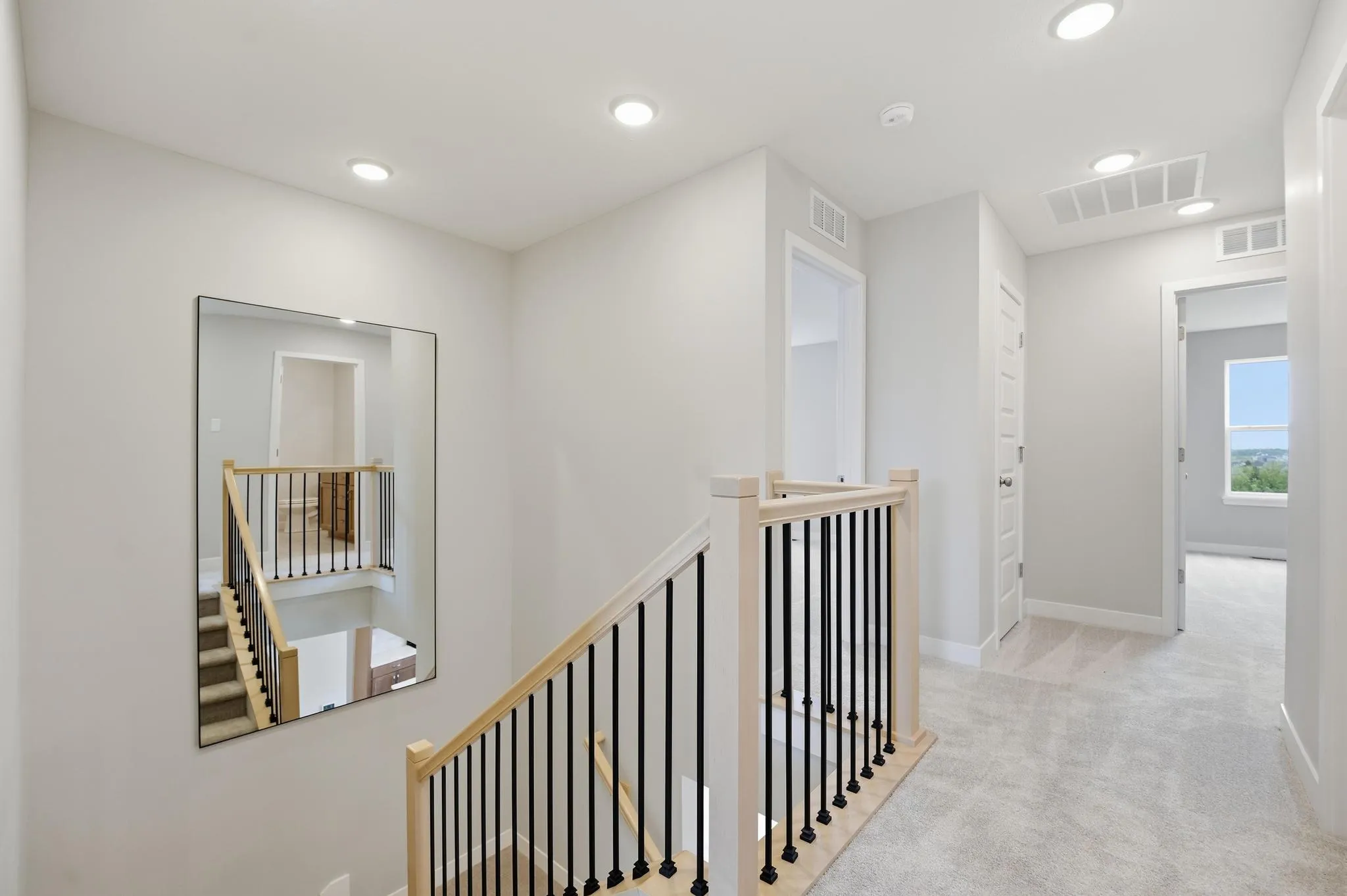 Spacious entry and stairs leading to the basement on the Gardenia Farmhouse Floorplan 808 Glenn Cir. Lot 144