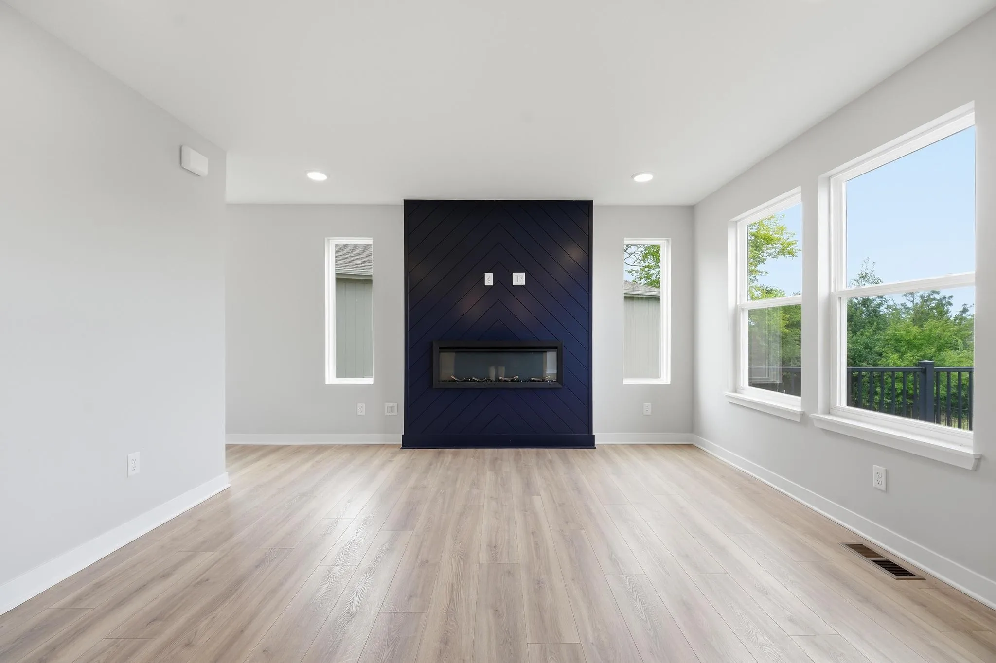 Elegant and spacius living room with a fire place featured in the Gardenia Farmhouse floorplan 808 Glen Cir Lot 144