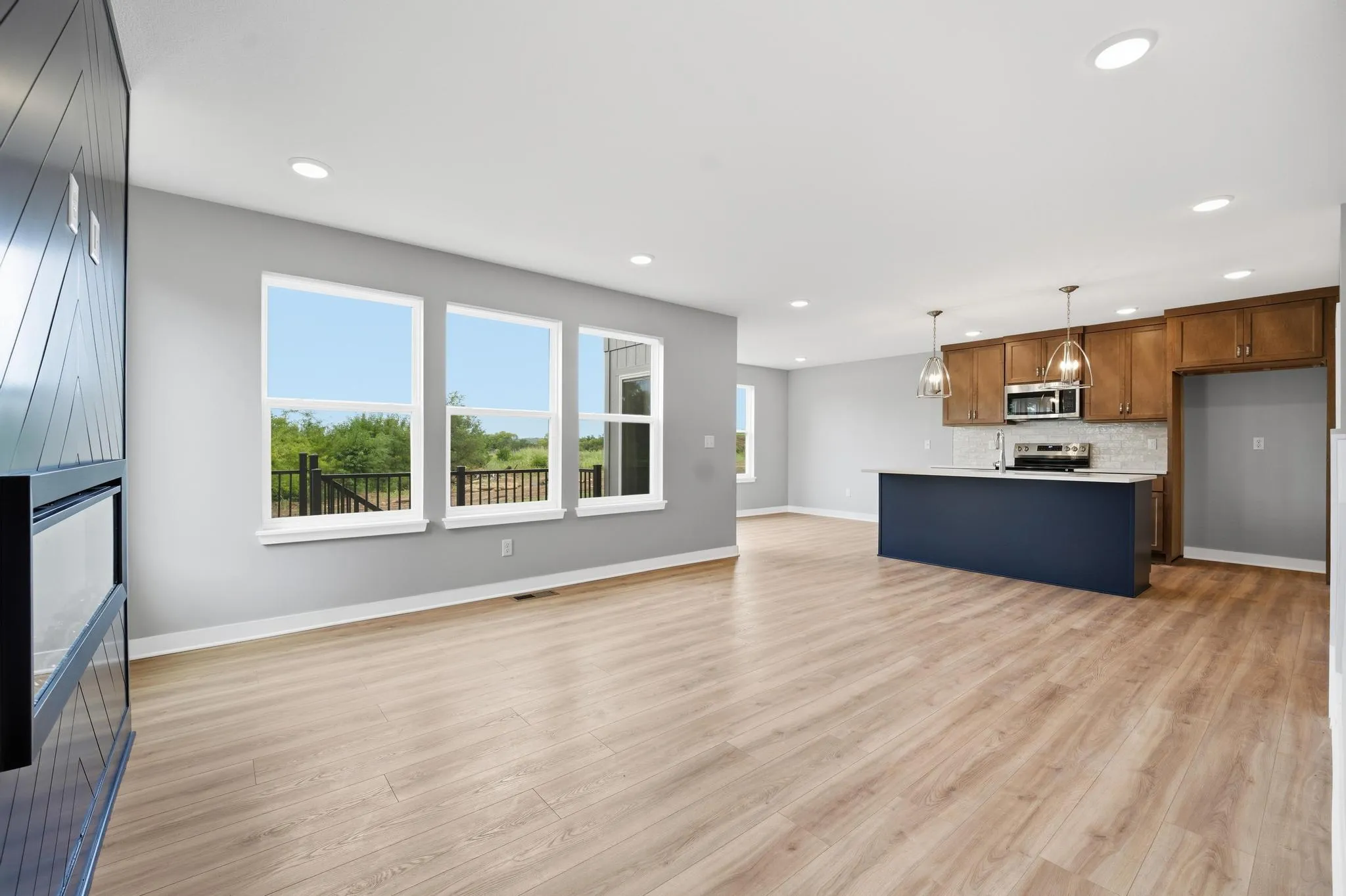 Spacious living room and kitchen in the Gardenia Farmhouse Floorplan 808 Glenn Cir. Lot 144