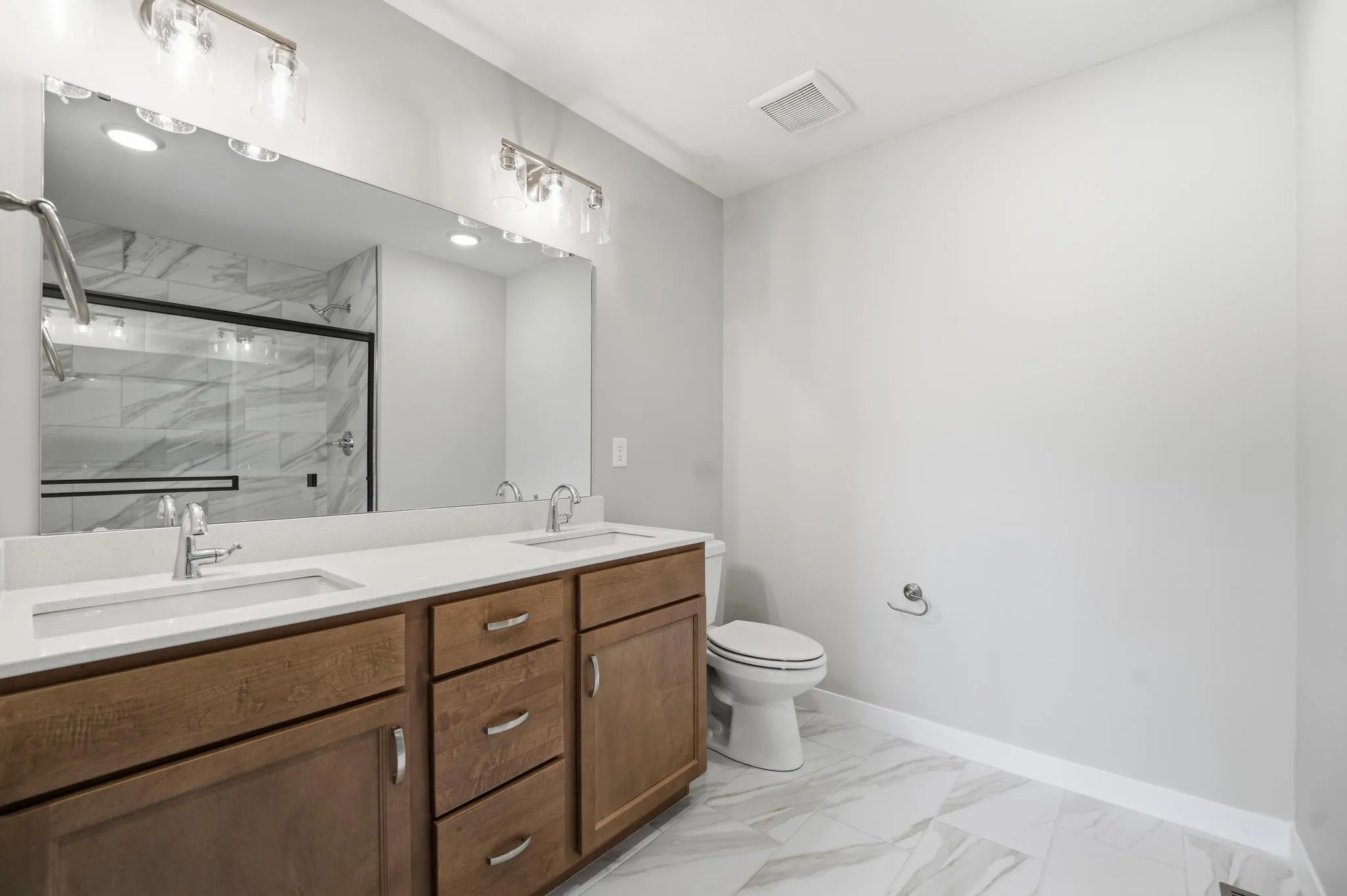 Large second bathroom featured in the Gardenia Farmhouse Floorplan 808 Glenn Cir. Lot 144