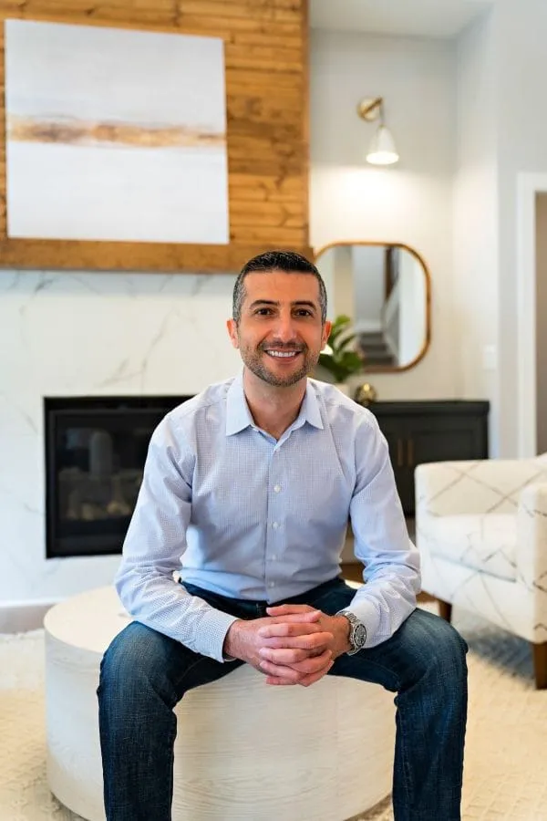 Avital Homes leader seated in a model home